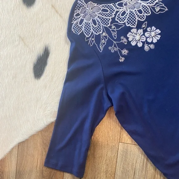 Alfred Dunner navy blue top featuring prominent white floral embroidery - Picture 8 of 10